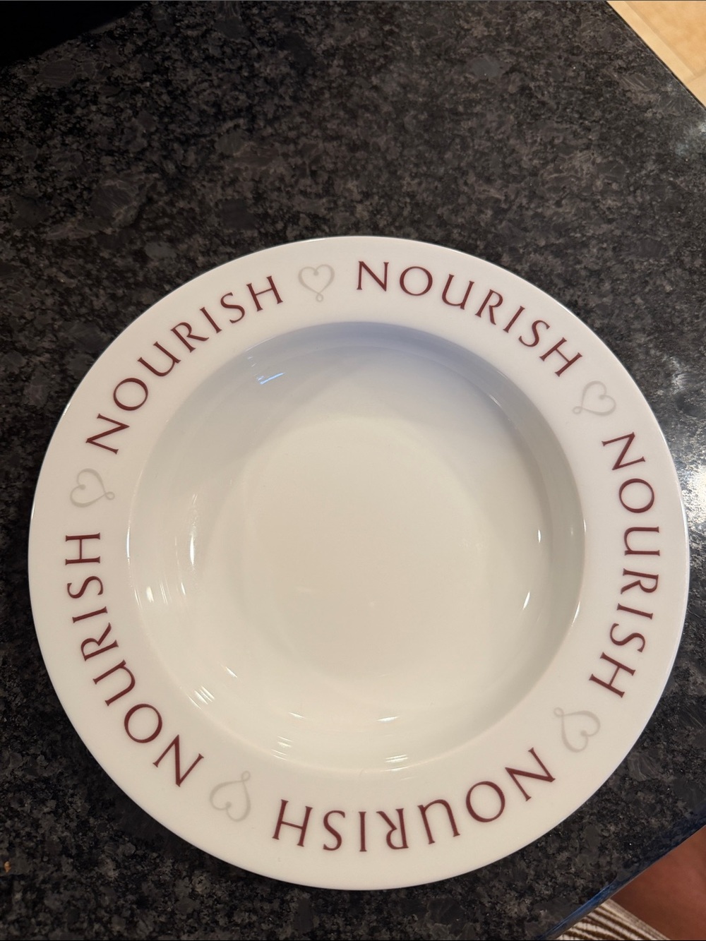 The Pampered Chef White Ceramic Bowl with Red 'Nourish' Lettering